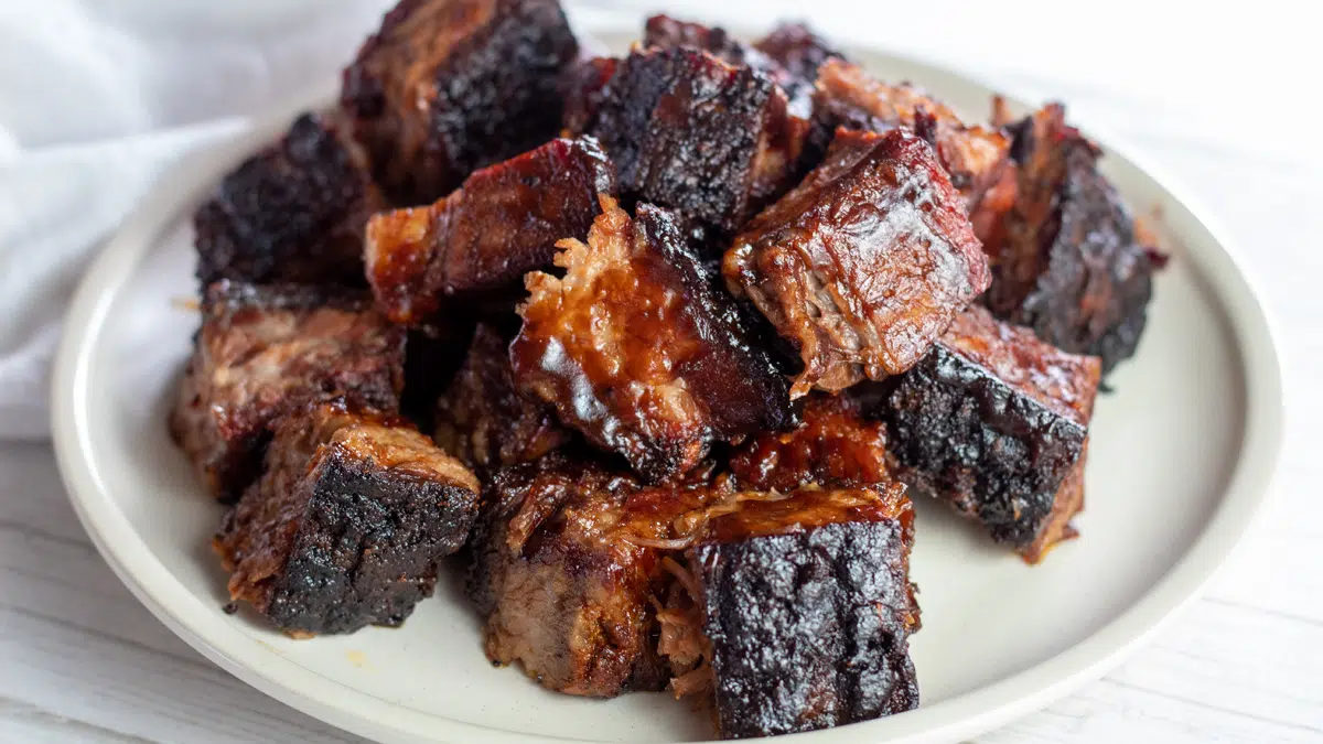 Wide closeup on the plated and served BBQ brisket burnt ends.