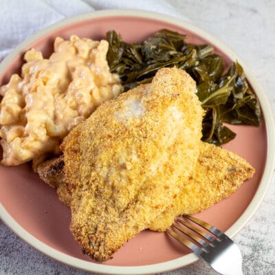 Best oven fried catfish fillets with tasty breading served on dusty rose colored plate.