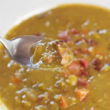 Wide image of split pea soup with smoked ham hocks.