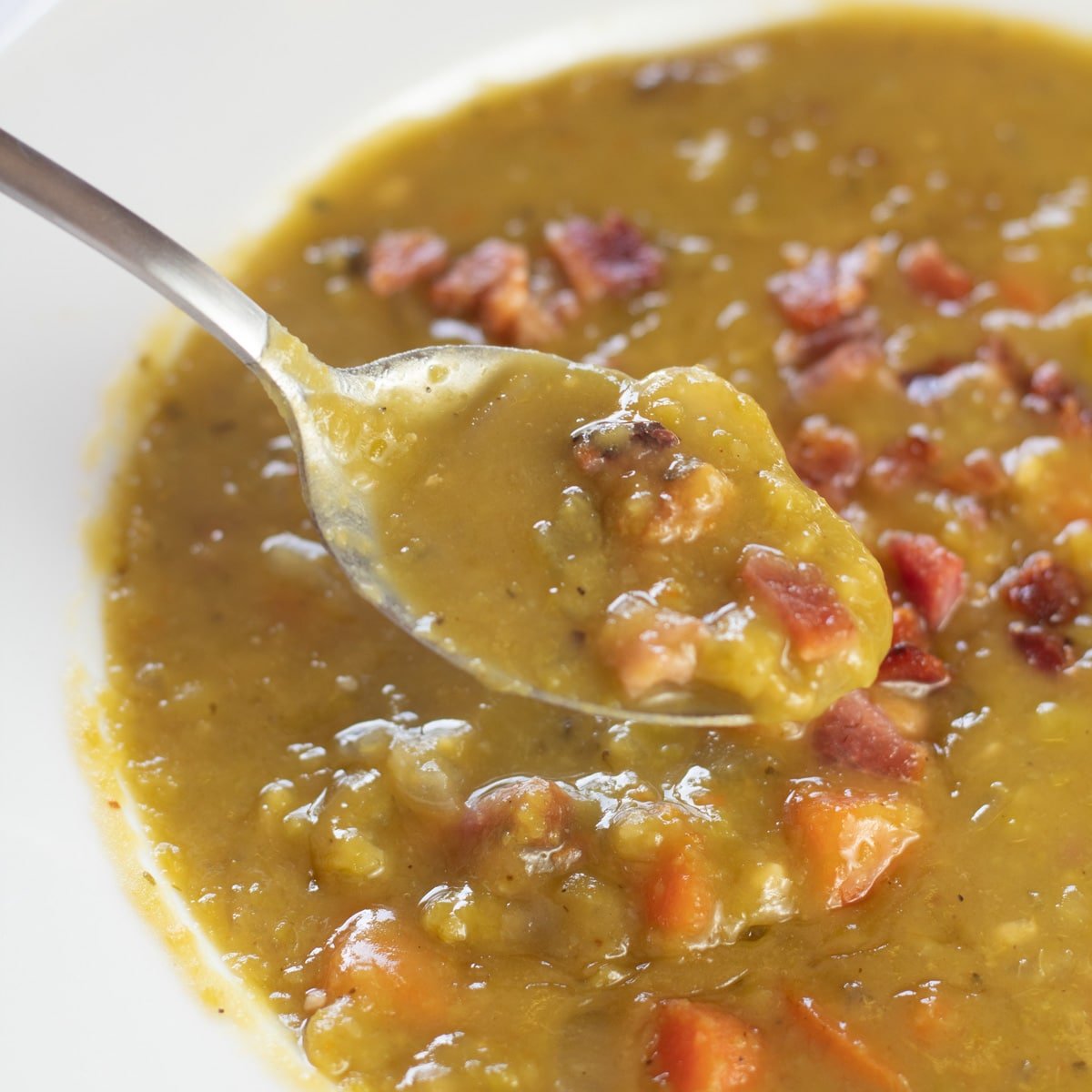 Square image of split pea soup with smoked ham hocks.