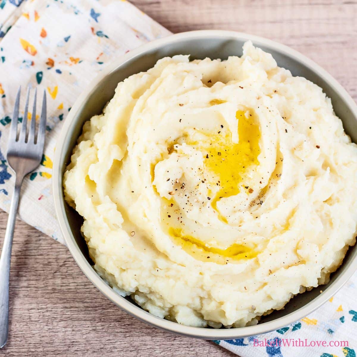 Easy Instant Pot mashed potatoes served in a bowl and topped with melting butter.