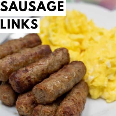 Air fryer frozen sausage links pin with red and black text that says 'air fryer sausage links' with a stack of perfectly cooked sausage links and scrambled eggs in the background.