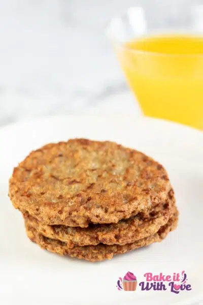 Tall image of air fryer frozen sausage patties.