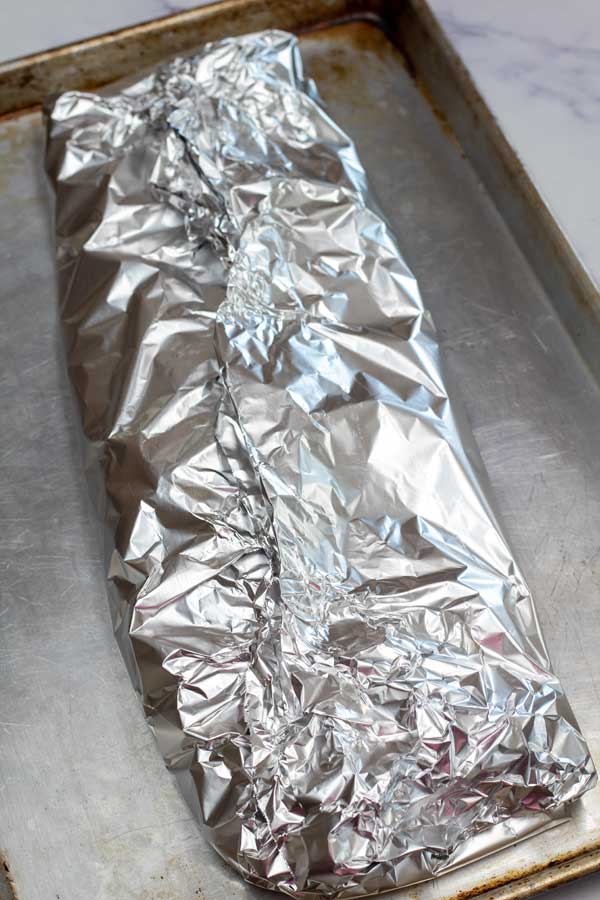 Process image 4 showing tin foil wrapped ribs.