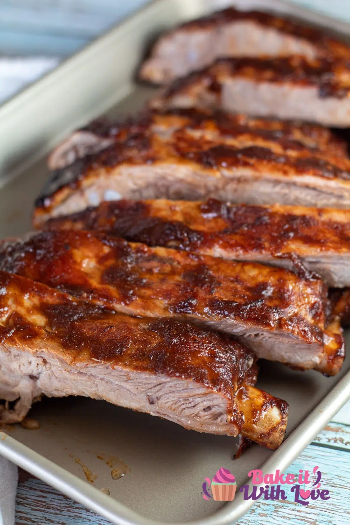 Tall image of baked bbq pork spare ribs.