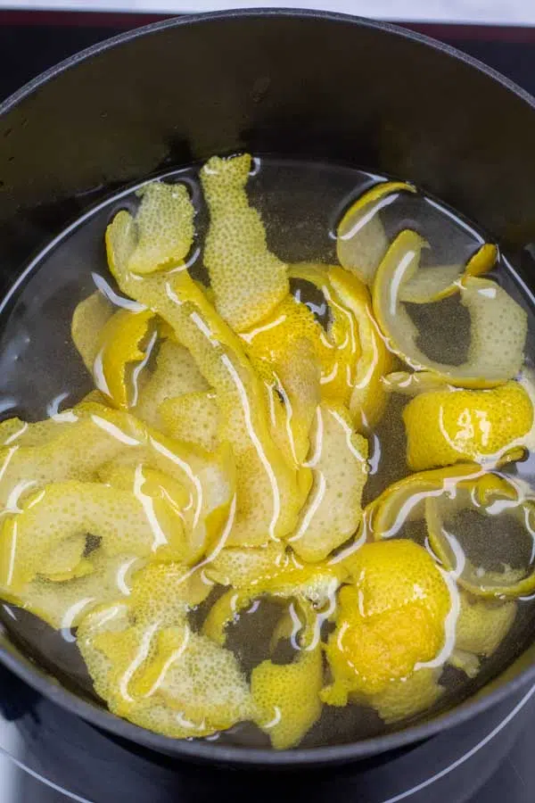 Process photo 3 add the lemon peels to the simmering syrup.