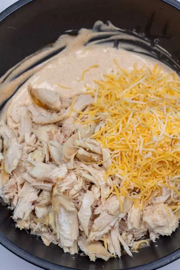 Add shredded, pulled, leftover, or canned chicken and cheese.
