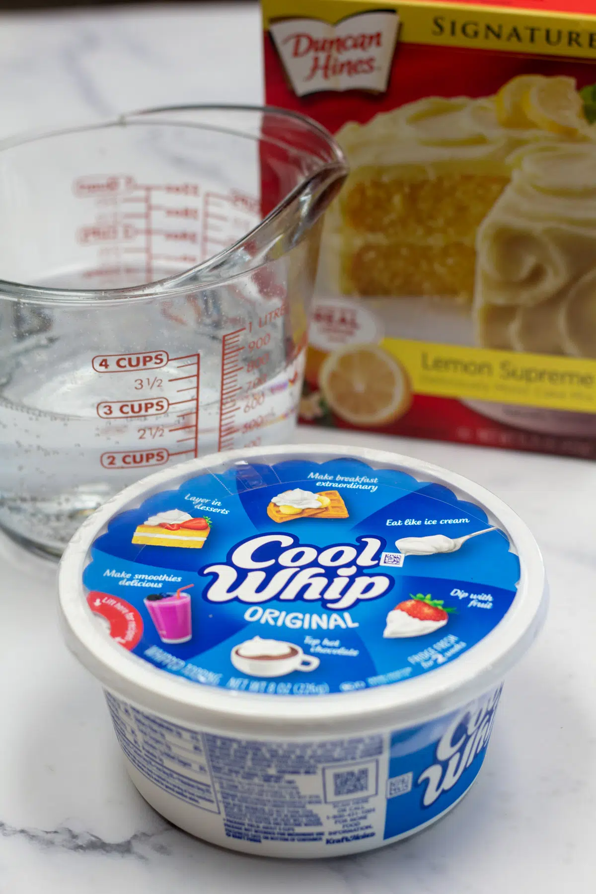 Tall photo showing ingredients needed for weight watchers 7UP cake.