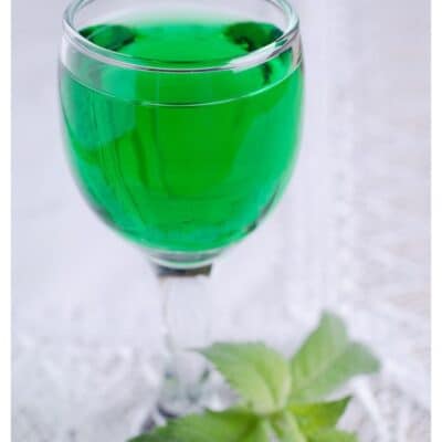 Pin image with text of a creme de menthe substitute in a glass.