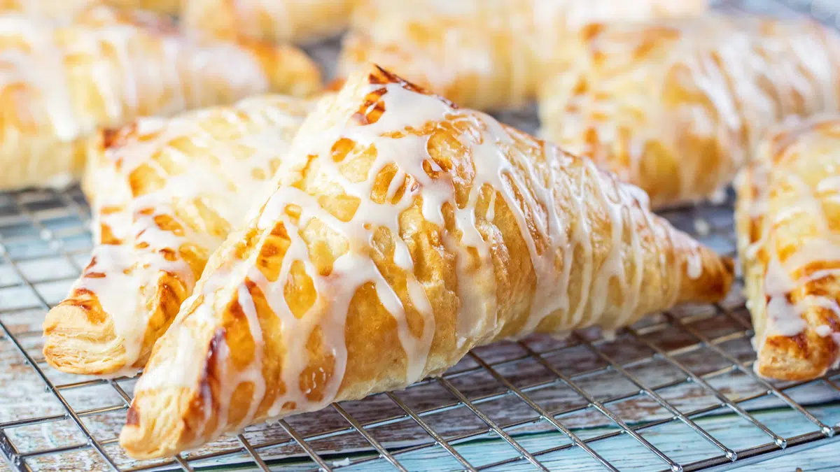 Wide closeup onthe amazingly tasty puff pastry apple turnovers.