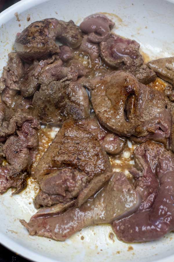 Process image 3 showing cooking beef livers in a frying pan.