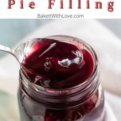 Pin image with text of blackberry pie filling in a glass jar with a spoon full of the pie filling.