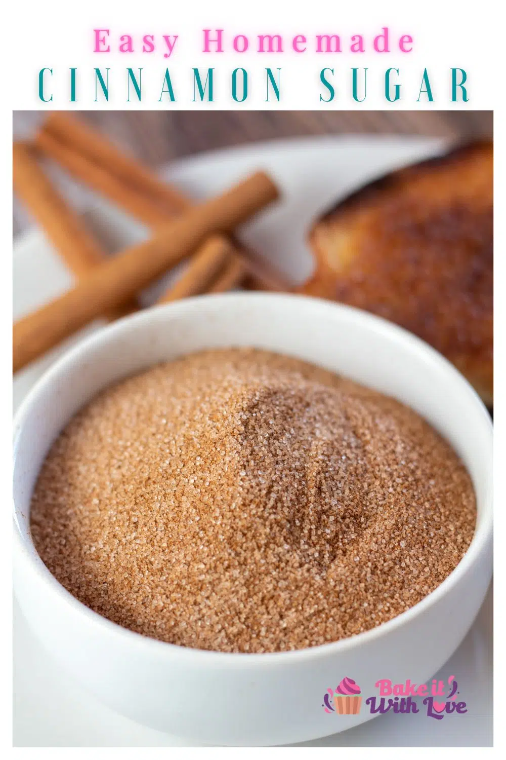 Pin image with text showing cinnamon sugar in a small bowl with toast and cinnamon sticks.
