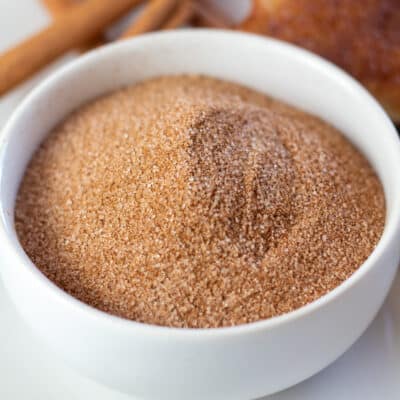 Square image showing cinnamon sugar in a small bowl.