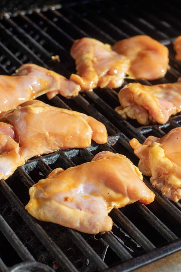 Process image 2 showing boneless skinless chicken thighs on the grill.