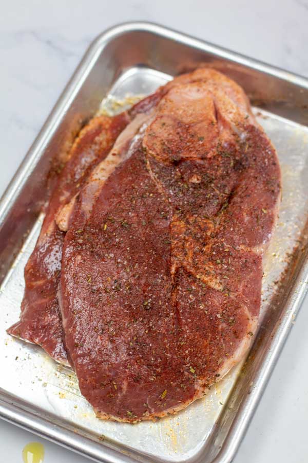 Process image 1 showing seasoned lamb steak.