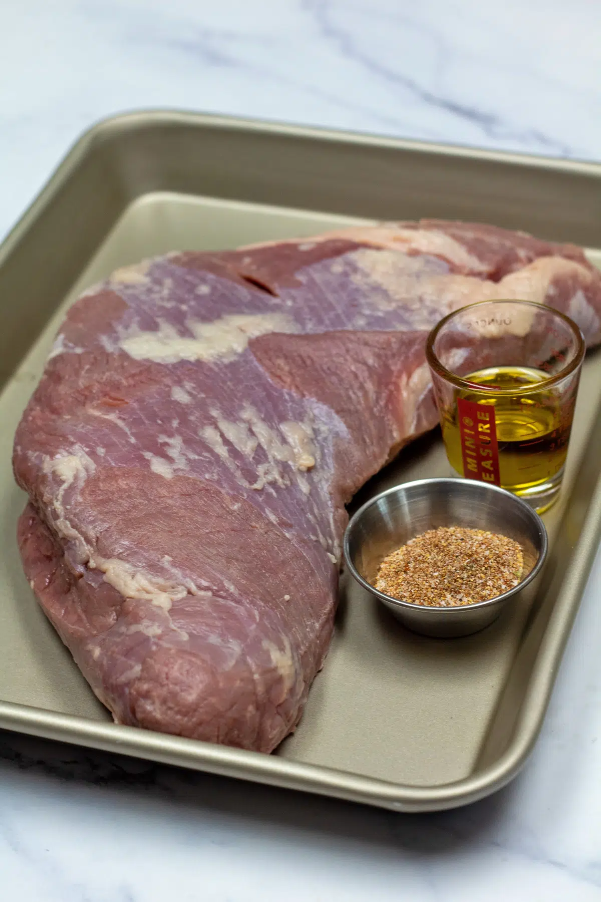 Tall image of ingredients used in this recipe for grilled tri-tip.