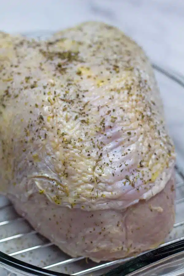 Oven roasted turkey breast process photo 2 applying the seasoning.