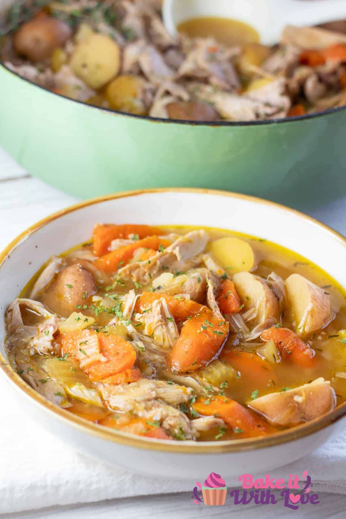 Tall image of a large bowl of rabbit stew.