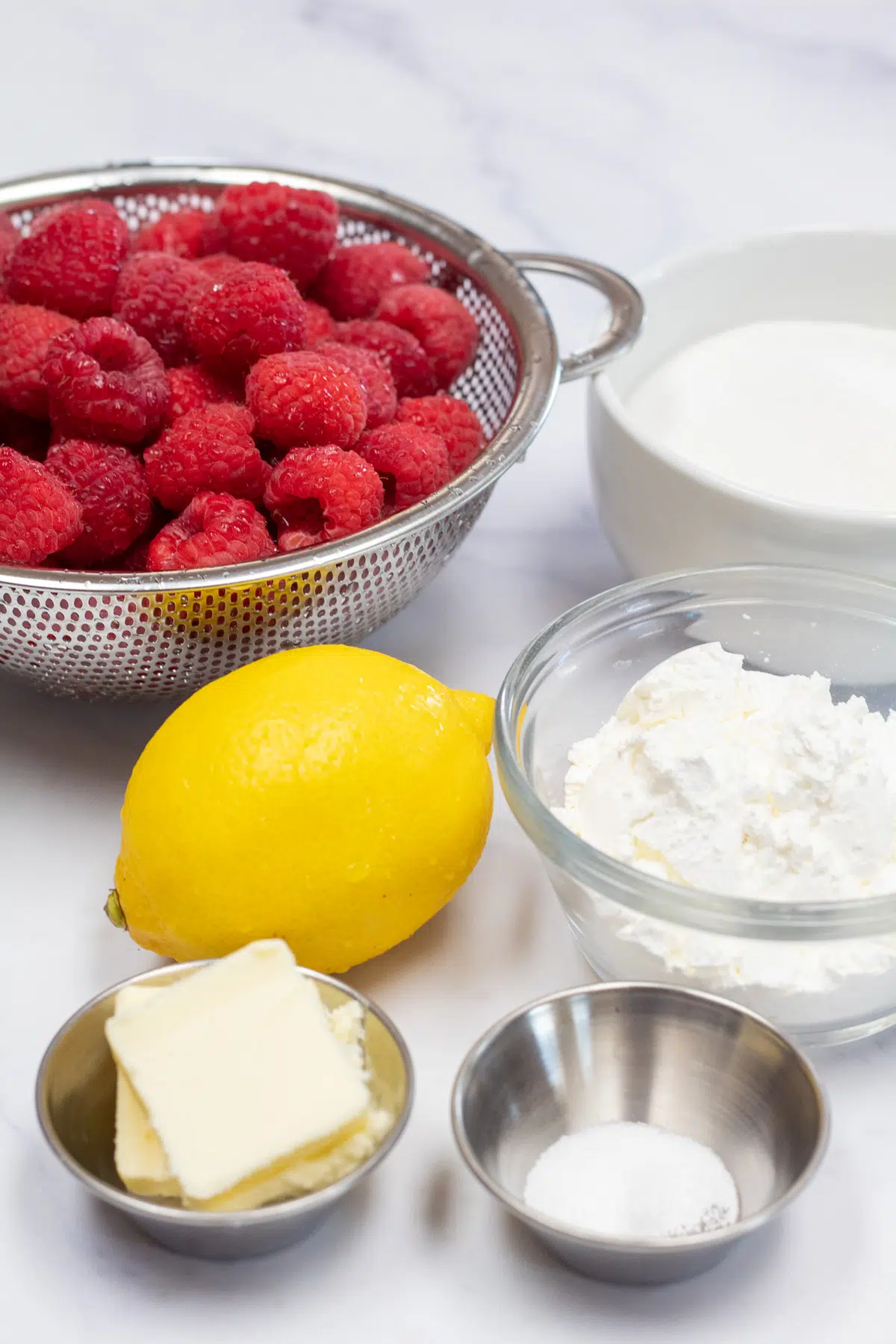 Tall image of raspberry pie filling ingredients.