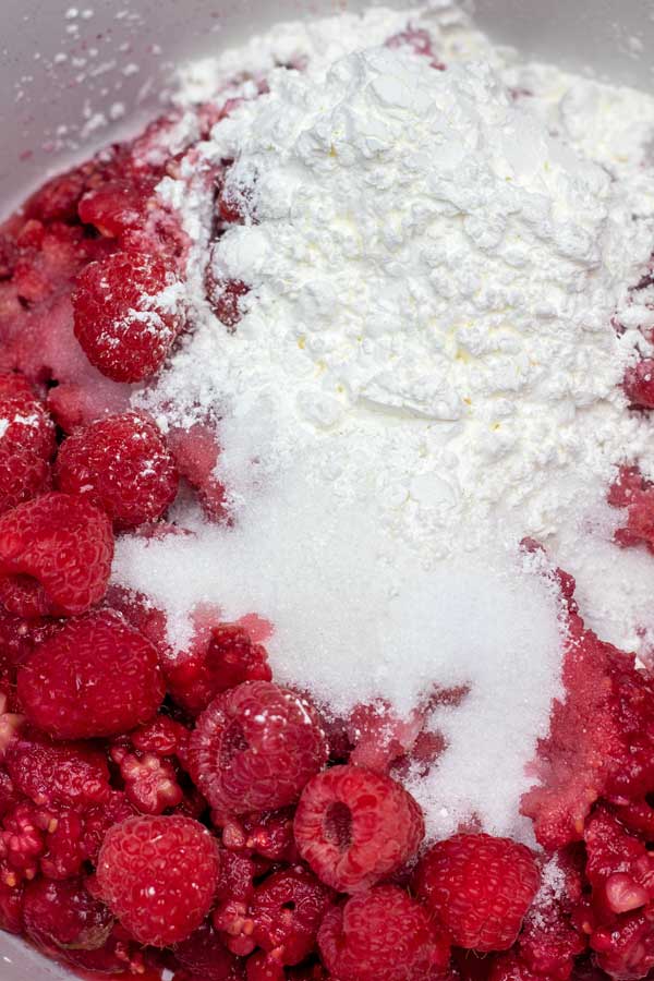Process image 1 showing raspberries, sugar,cornstarch, and lemon juice in saucepan.
