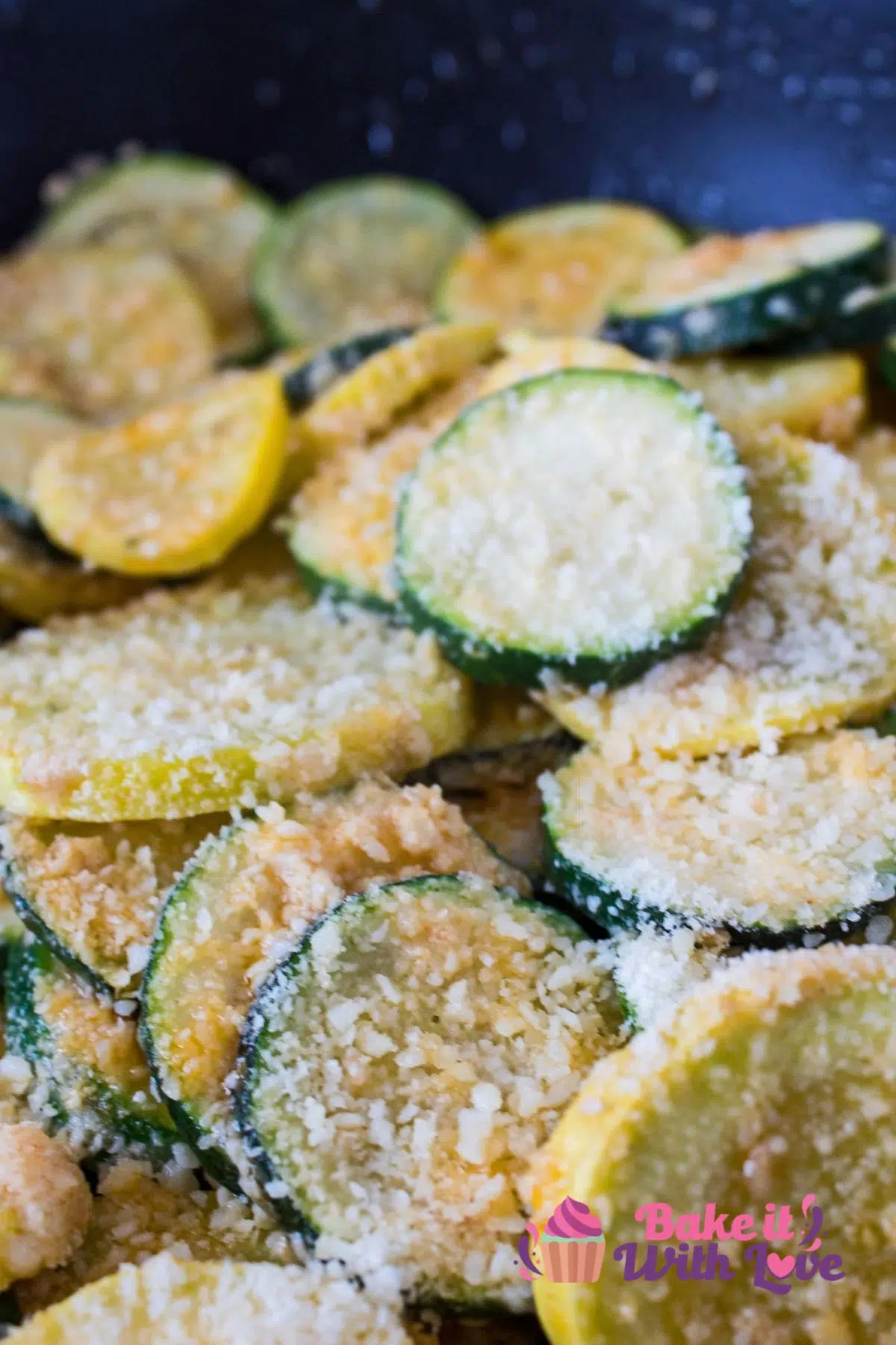 Sautéed zucchini and yellow squash with garlic and Parmesan cheese is one of the absolute easiest ways ever to enjoy your abundant crop of summer squash! These are two of my favorite veggies, and they are absolutely delicious when pan-fried with garlic and then tossed in Parmesan! Your entire family will enjoy this healthy, easy side dish. BakeItWithLove.com #bakeitwithlove #sauteed #zucchini #squash #recipe #sidedish