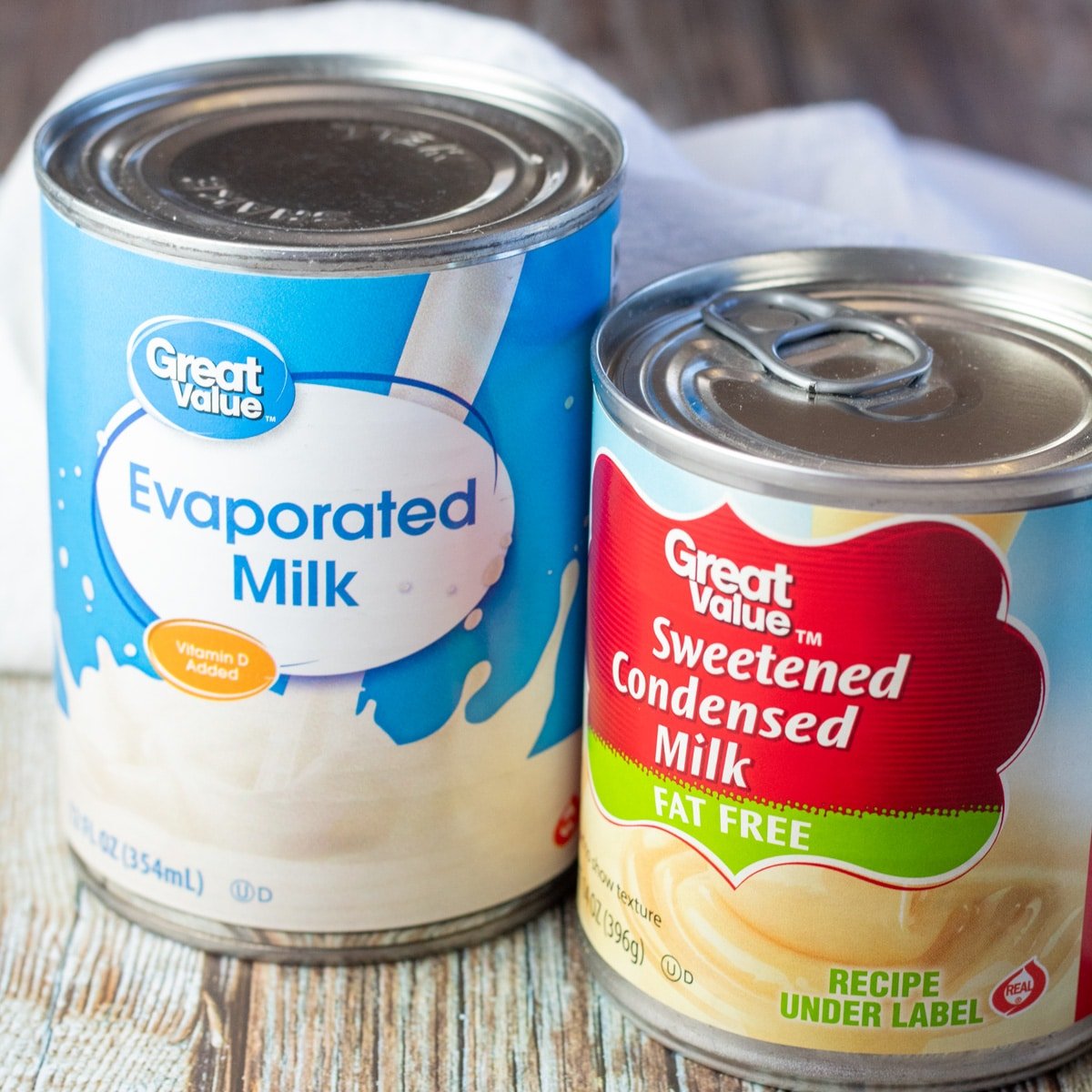 Square image of evaporated milk in a can next to sweetened condensed milk in a can.