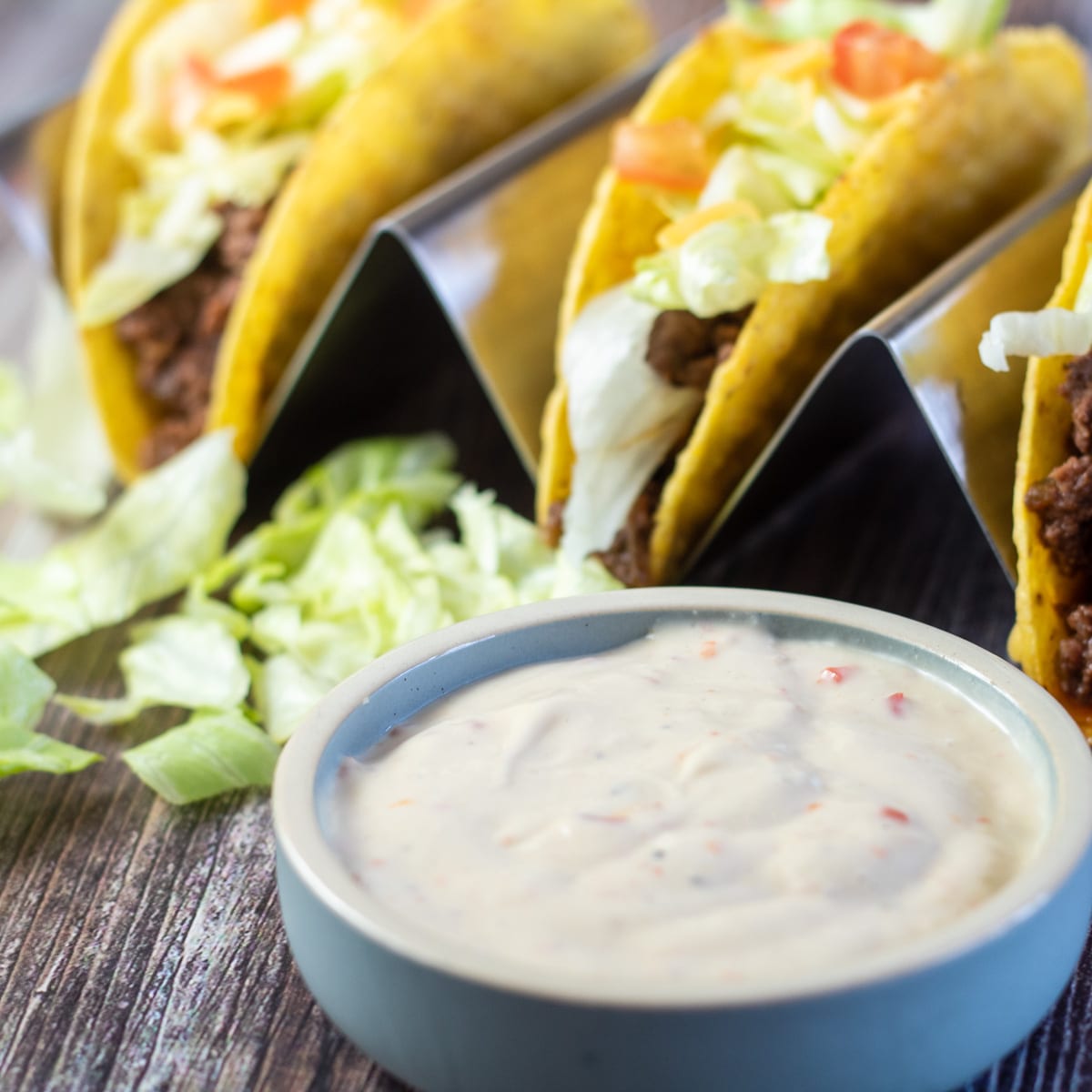 Square image showing tacos and Taco Bell creamy Baja sauce.