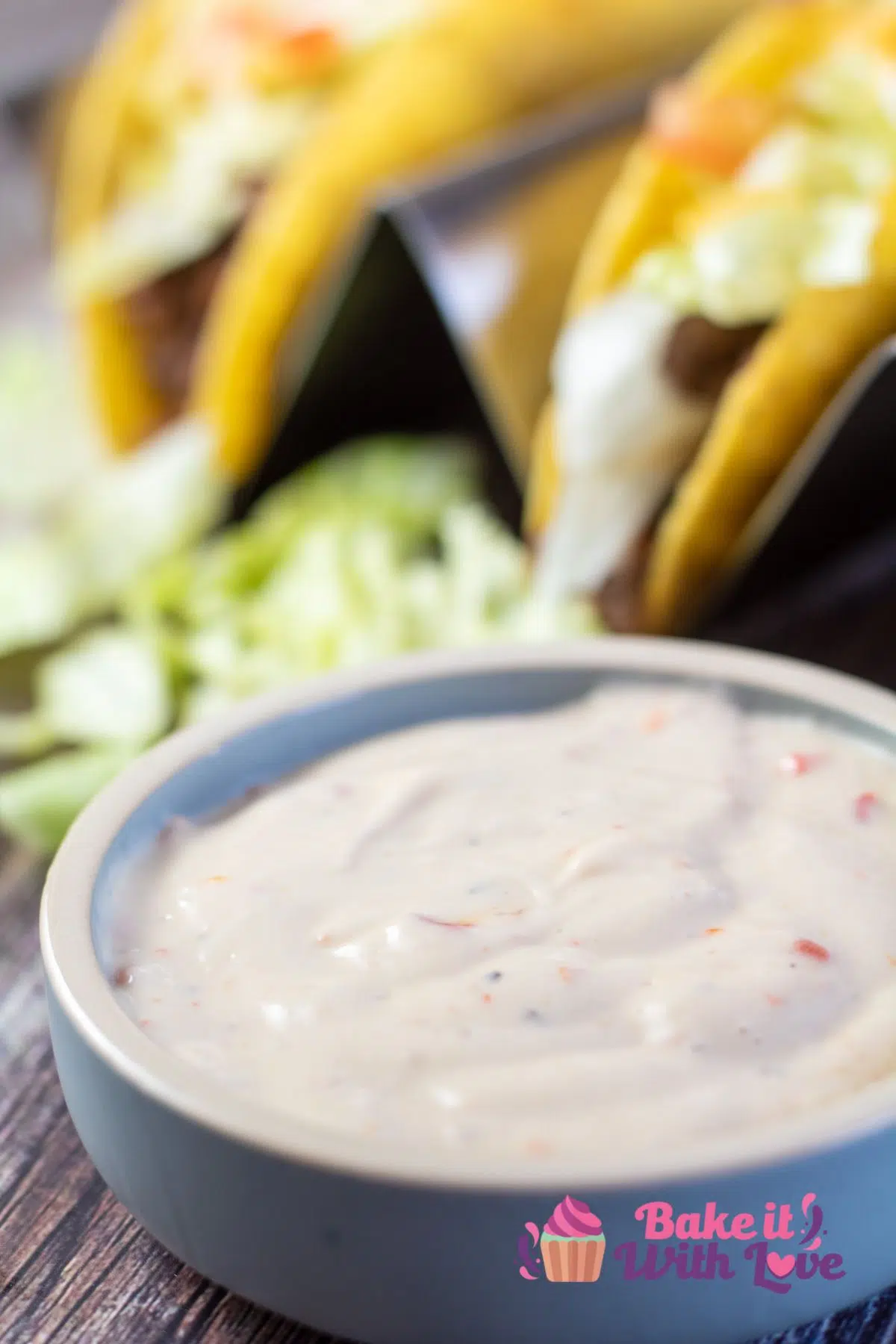 Tall image showing tacos and Taco Bell creamy Baja sauce.