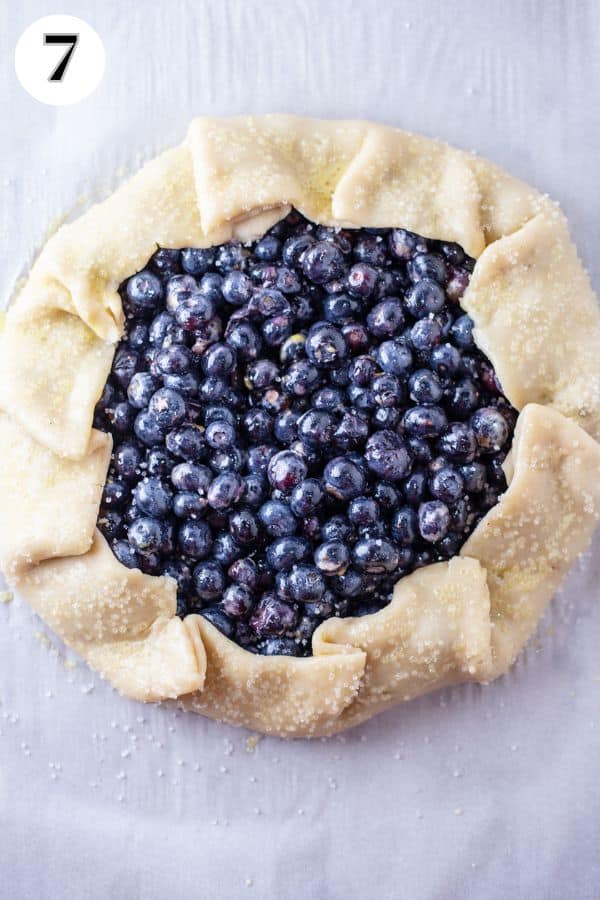 Blueberry galette process photo 7 roll out pie dough then add filling and fold edges up.