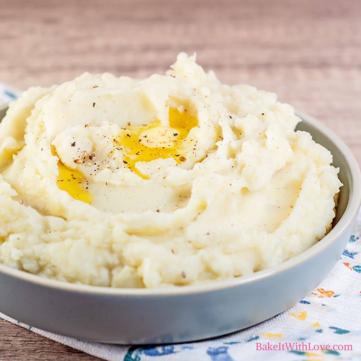 How to freeze mashed potatoes square image showing a bowl full of mashed potatoes with melted butter on top.