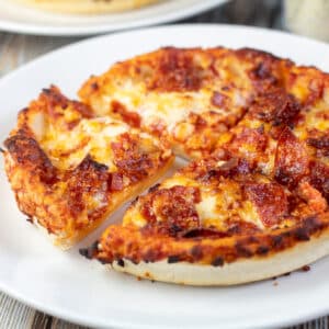 Square image of a small pizza just out of the air fryer.