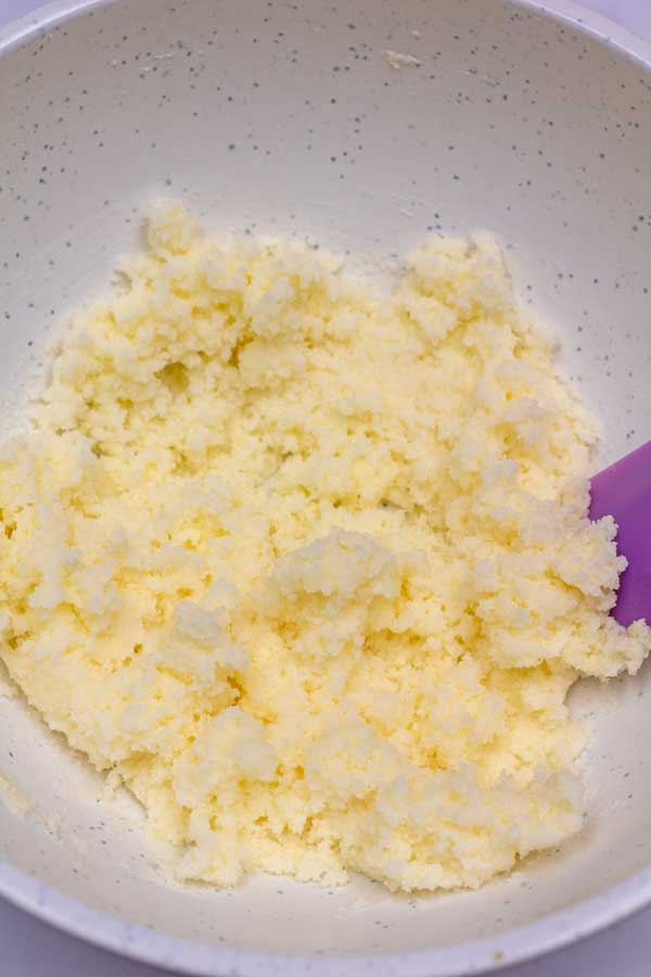 Process image 2 showing creamed butter and sugar in mixing bowl.