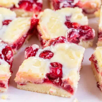 Square image of cherry pie bars.