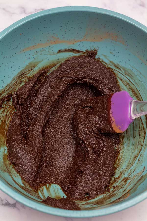 Process image 2 showing butter and cocoa powder mixed in mixing bowl.
