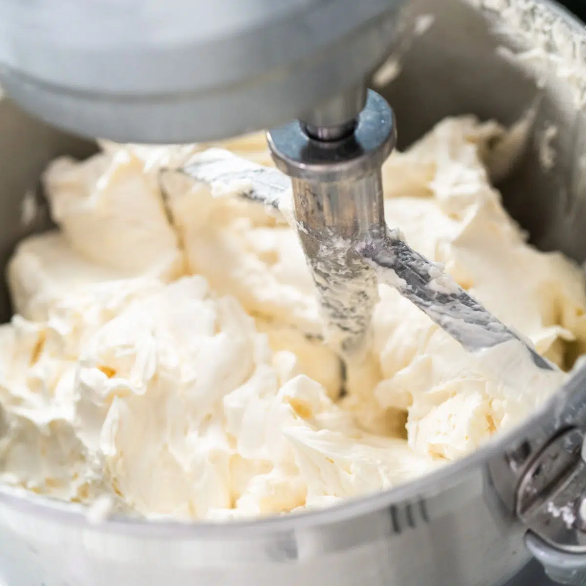 Square image of frosting in a mixer.