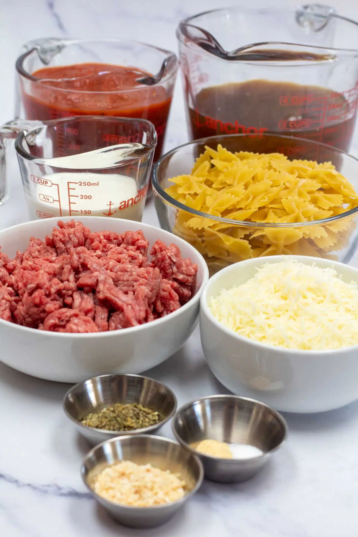 Tall image of ingredients for copycat hamburger helper lasagna.