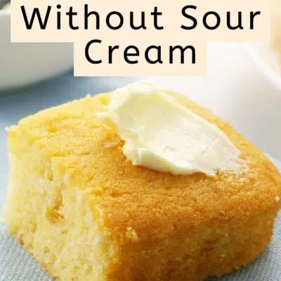Pin image of a piece of cornbread with a pat of butter on top.