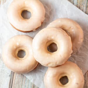 Overhead square image of peanut butter baked donuts.