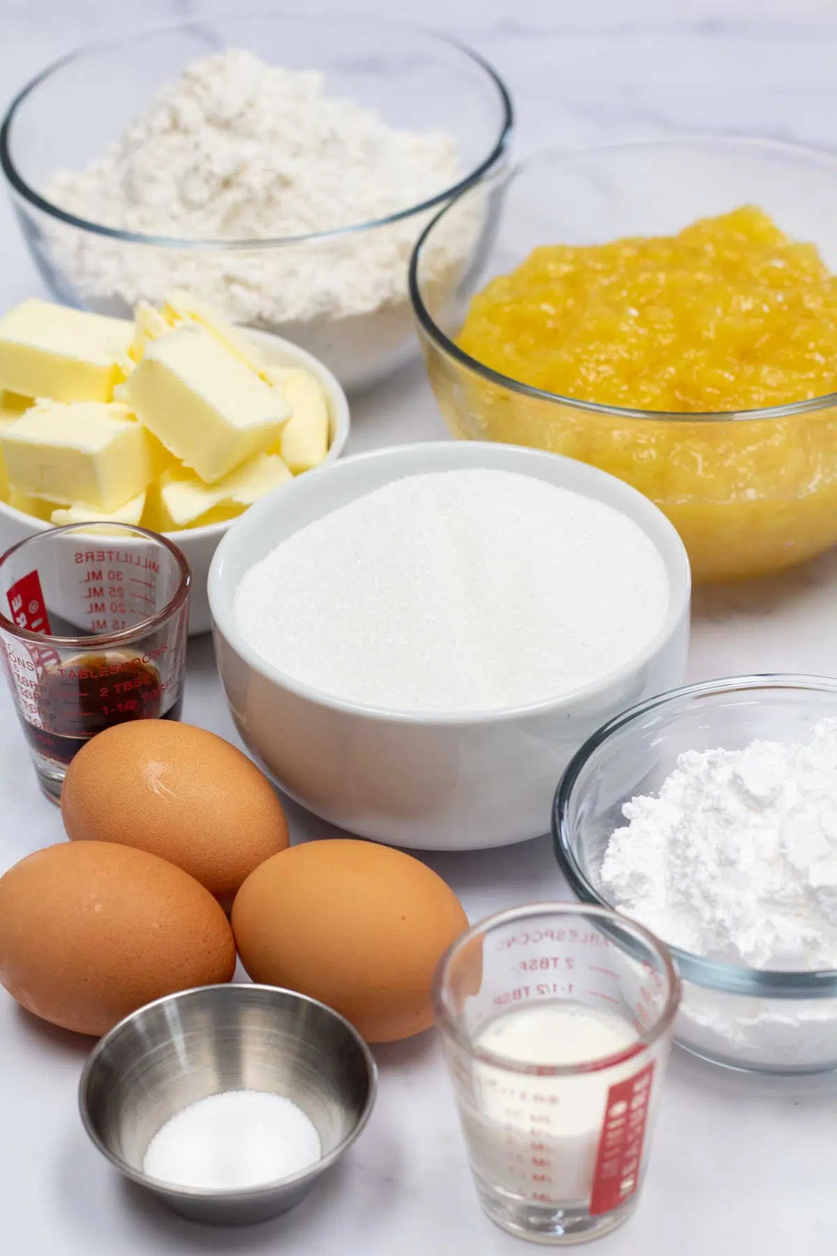 Tall image showing ingredients needed for pineapple pie bars.