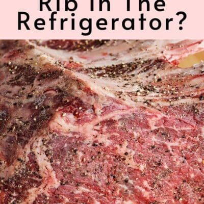 Pin image with text of raw prime rib.