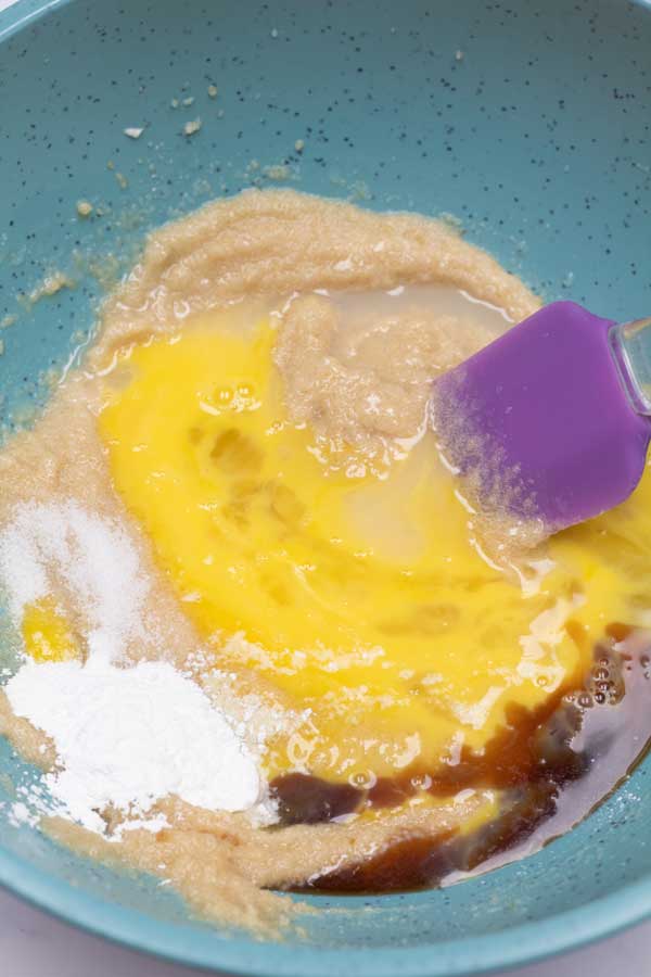 Process photo 3 showing added egg, vanilla, and baking soda.