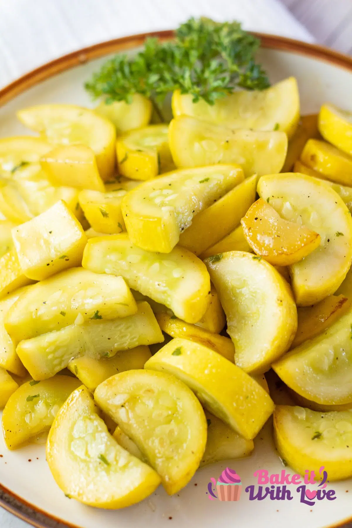 Tall image of a plate with sauteed yellow squash.