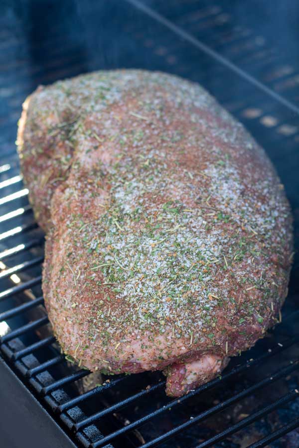 Process image 2 showing leg of lamb in the smoker.