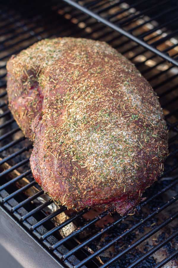 Process image 3 showing leg of lamb in the smoker almost finished.