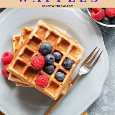Pin image with text showing waffles with fruit and syrup.