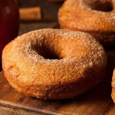 Square image of apple cider donuts.