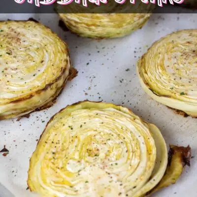 Pin image of baked cabbage steaks.