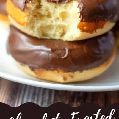 Pin image with text of chocolate fosted baked donuts on a white plate.