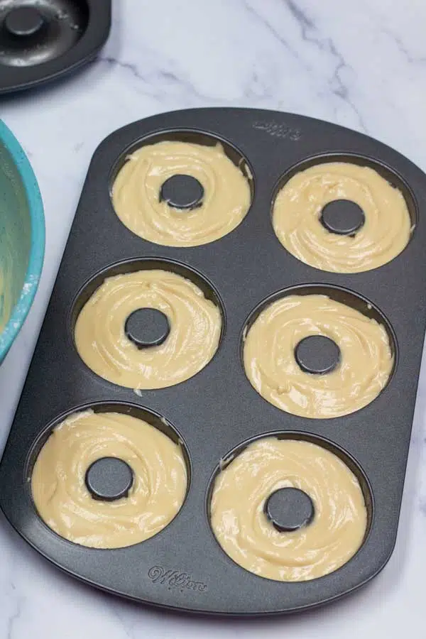 Process image 5 showing combined donut batter in baking pan.